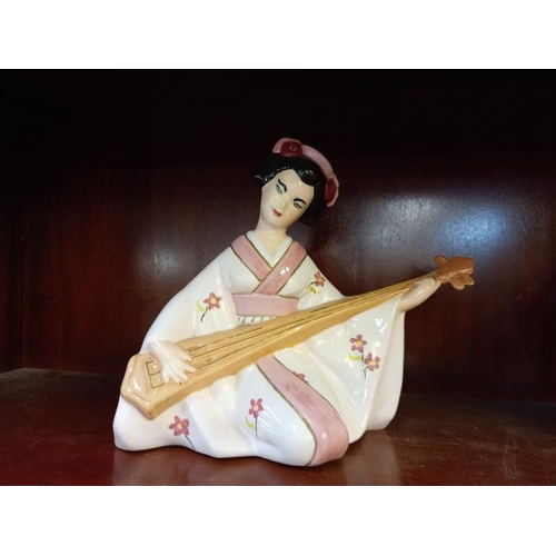 601 - 2 Japanese Geisha pottery figures