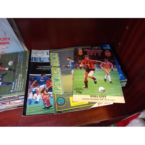 604 - A large quantity of football programmes including Tottenham Hotspurs, Aston Villa and Bradford City ... 