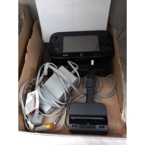 624 - A Nintendo Wii with balance board and Wii U.