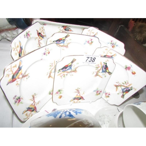 738 - A pretty bird decorated china tea set.