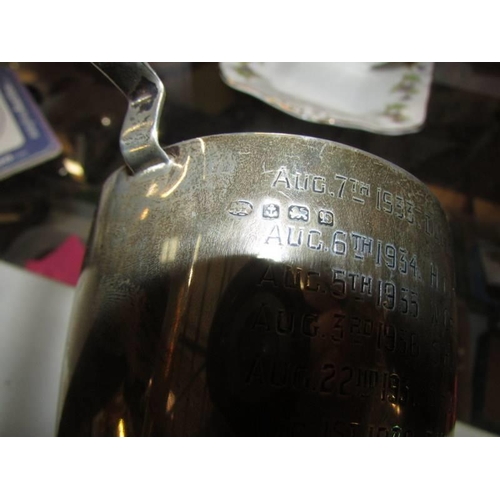 756 - A Birmingham silver 1930 pigeon racing trophy engraved 1933-1941 Dents and Creases. 6 3/8oz or 180g