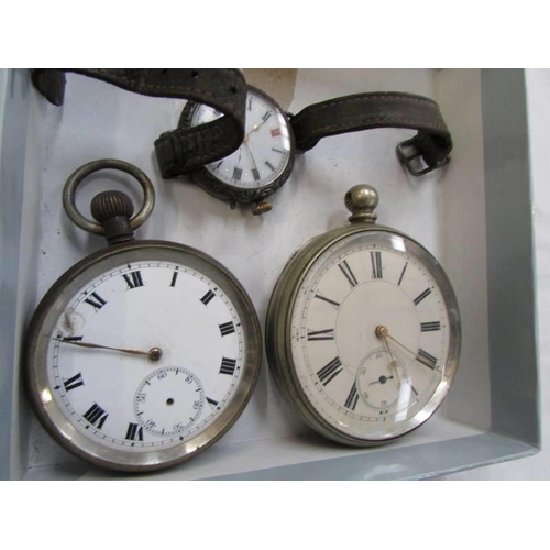 765 - A silver cased wrist watch and two metal cased pocket watches, all a/f.