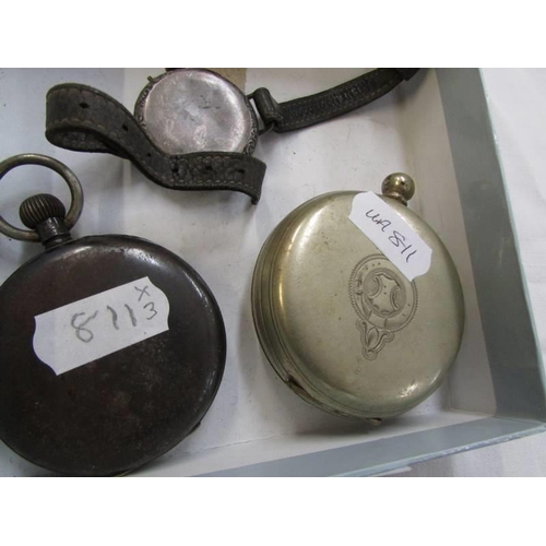 765 - A silver cased wrist watch and two metal cased pocket watches, all a/f.