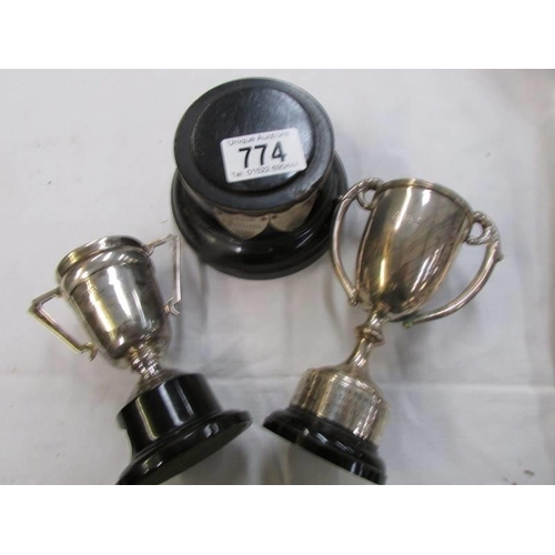 774 - A silver cup, 1 other and one base.