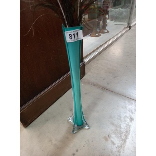 811 - A 1930's blue glass spill vase containing peacock feathers (vase 40 cm).