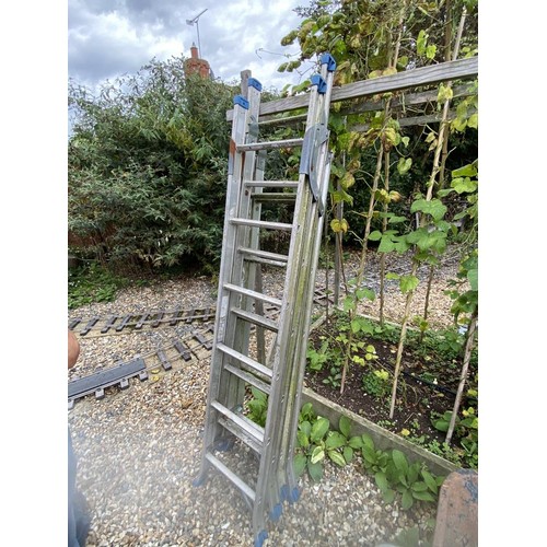 136 - A heavy duty industrial triple ladder with adjustable feet and stays. Collect Only.