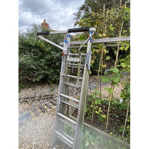 136 - A heavy duty industrial triple ladder with adjustable feet and stays. Collect Only.