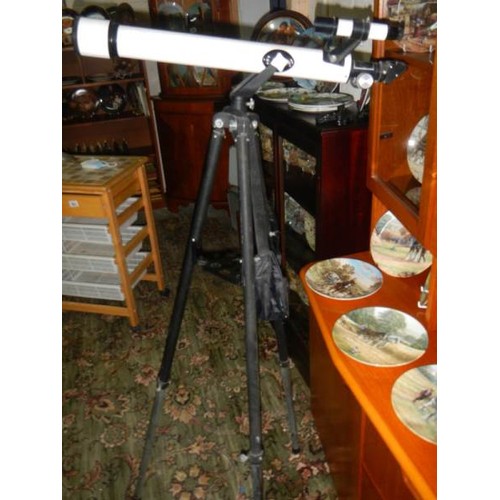 505 - A Tasco telescope on tripod.