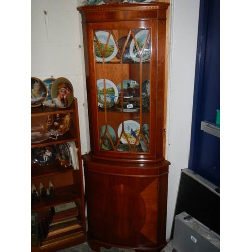 509 - A good quality mahogany glazed corner cabinet.