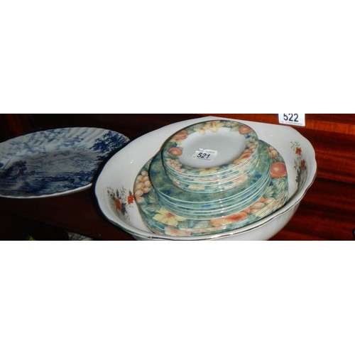 521 - A mixed lot of ceramic plates, bowls etc.,