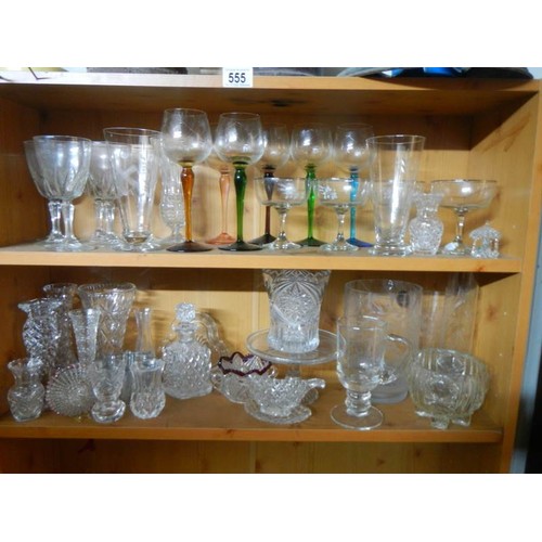 556 - Five shelves of assorted glass ware.