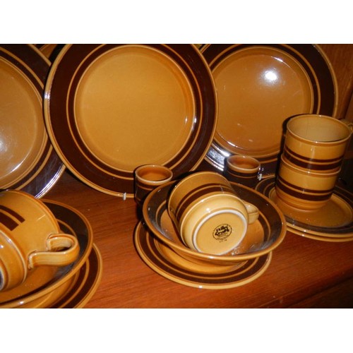 561 - A good lot of Kiln Craft dinner ware.