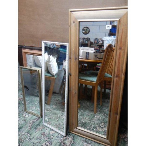 571 - A pine framed mirror and three others.