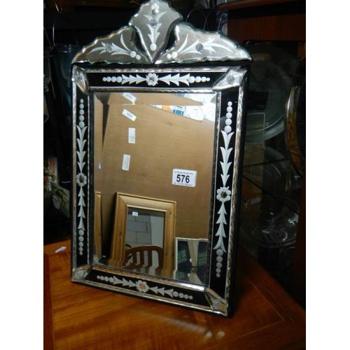 576 - A good quality bevel edged gypsy style mirror.