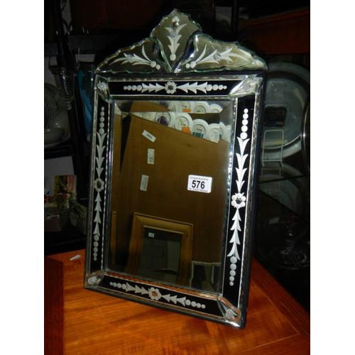 576 - A good quality bevel edged gypsy style mirror.