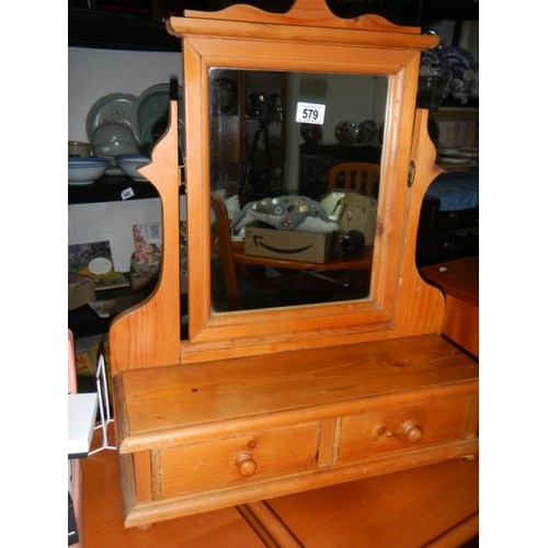 579 - A pine toilet mirror with two drawers.