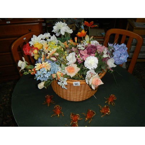 583 - A mixed lot of artificial flowers.