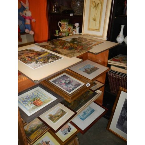 609 - Four shelves of assorted prints etc.,