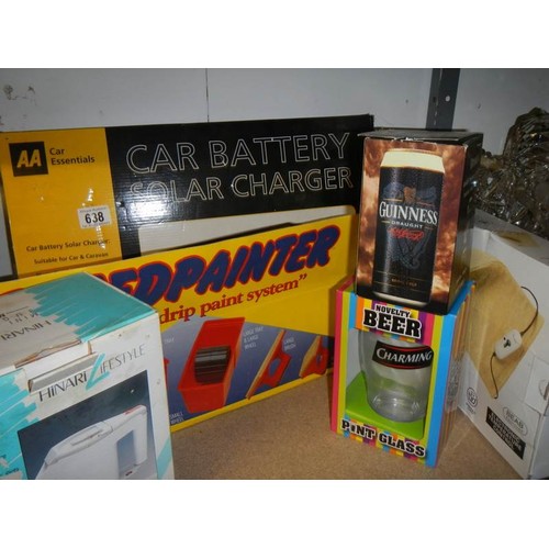 638 - A boxed car battery solar charges and other boxed items.