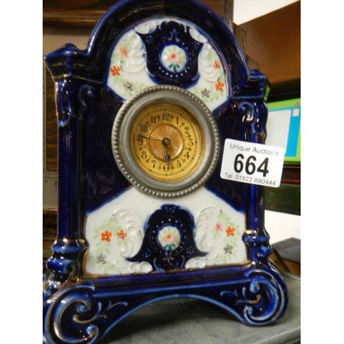 664 - A ceramic mantel clock.