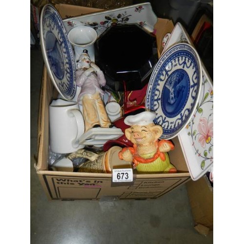 673 - A mixed lot of ceramics including piggy bank, plates etc.,