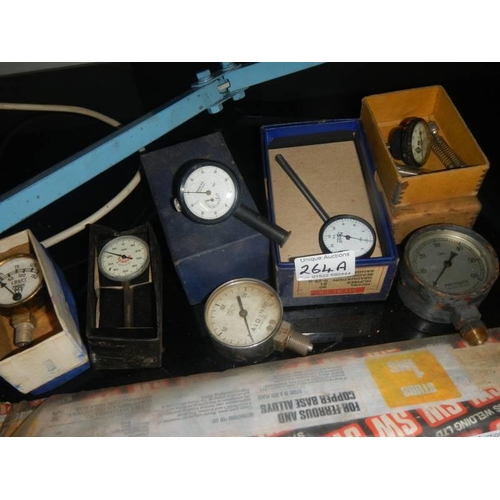 264A - A quantity of pressure gauges, some boxed.