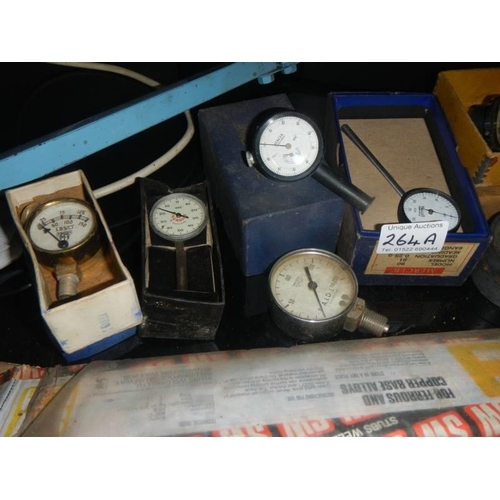 264A - A quantity of pressure gauges, some boxed.