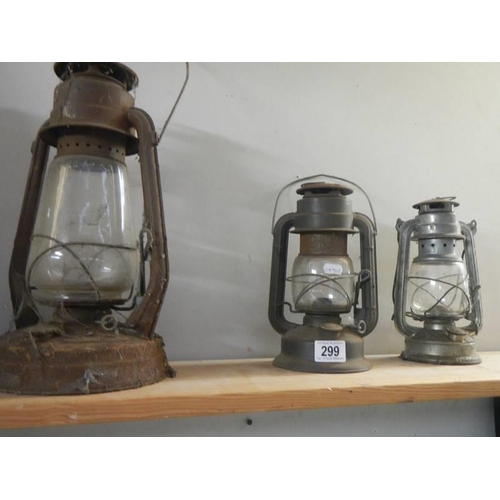 299 - 3 oil lamps.