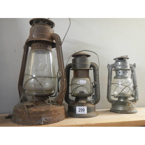 299 - 3 oil lamps.