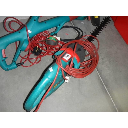 318 - A Bosch hedge trimmer and Bosch strimmer.