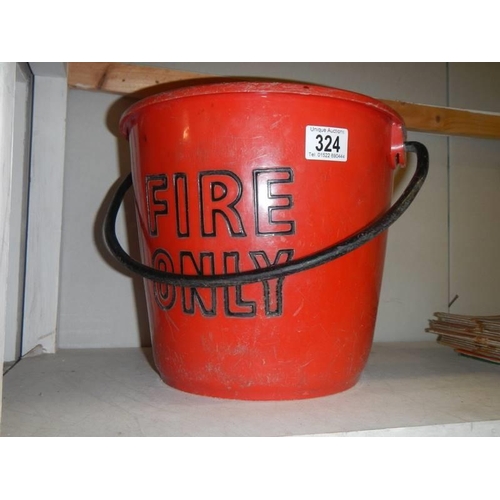 324 - Red plastic fire bucket.