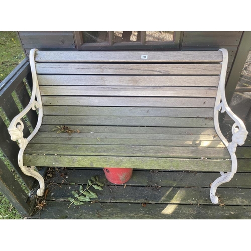 156 - A garden bench. oak slats and cast ends, in good condition. 49inc long. Collect Only.