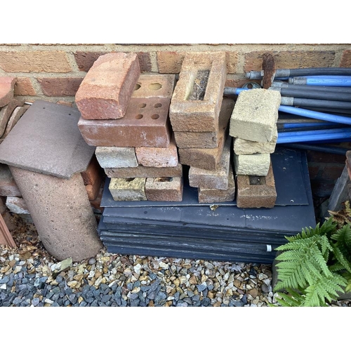 180 - A selection of bricks, tiles, ridges, slates etc. Collect Only.