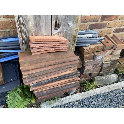 180 - A selection of bricks, tiles, ridges, slates etc. Collect Only.