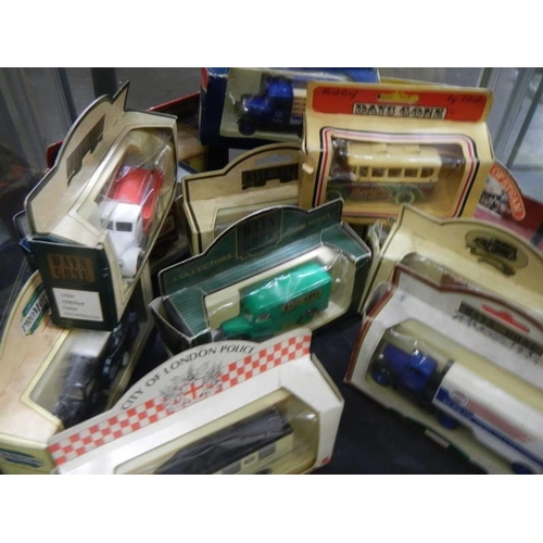 1518 - 26 Days Gone and Models of Yesteryear die cast vehicles, two shelves.