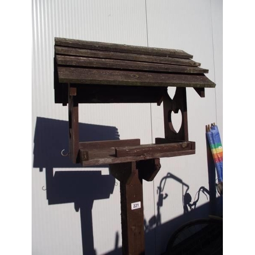 221 - A wooden bird table with heart cut aways. COLLECT ONLY.