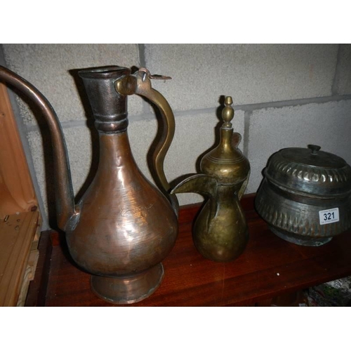 321 - Three old copper jugs etc.,