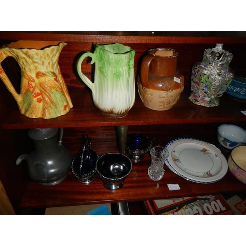 323 - A mixed lot of jugs, bowls, silver plate etc.,