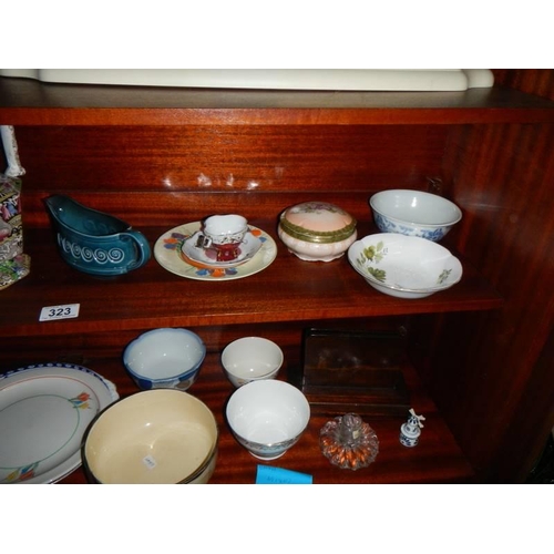 323 - A mixed lot of jugs, bowls, silver plate etc.,