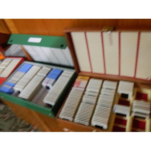 355 - Six boxes of slides and a viewer.