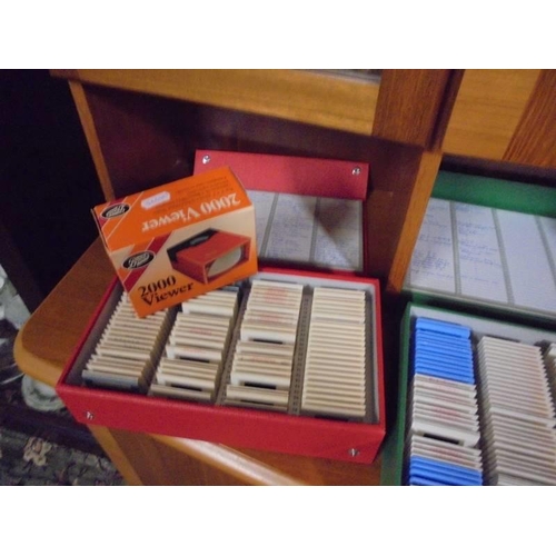 355 - Six boxes of slides and a viewer.