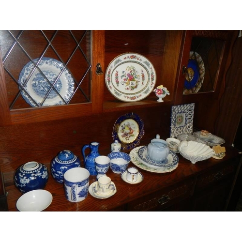 383 - A mixed lot of blue and white plates, jugs, bowls etc., including Willow Pattern.