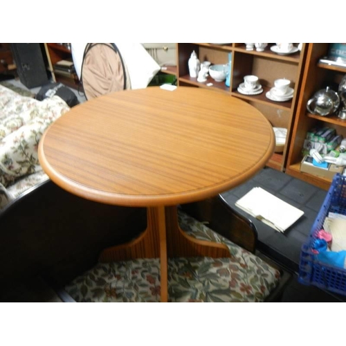 398 - A small circular teak side table. COLLECT ONLY.