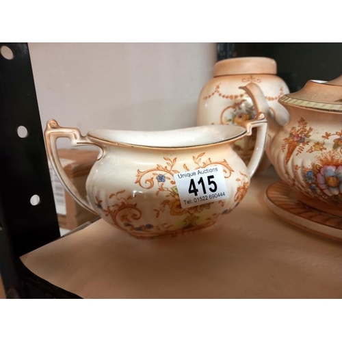 415 - A Crown Devon 3 piece tea set & a biscuit barrel