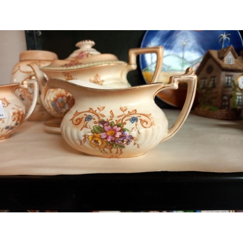 415 - A Crown Devon 3 piece tea set & a biscuit barrel