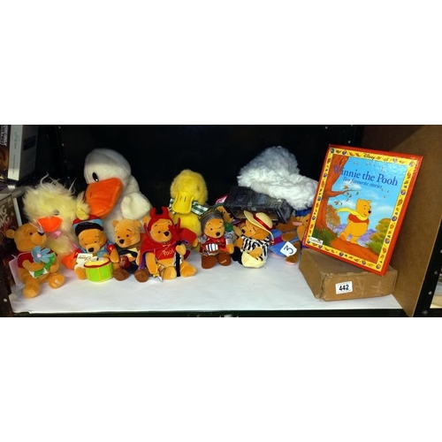 442 - A quantity of cuddly toys including Winnie The Pooh etc.