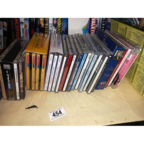 454 - A quantity of DVD's (some being box sets) & a quantity of CD's (1 shelf)