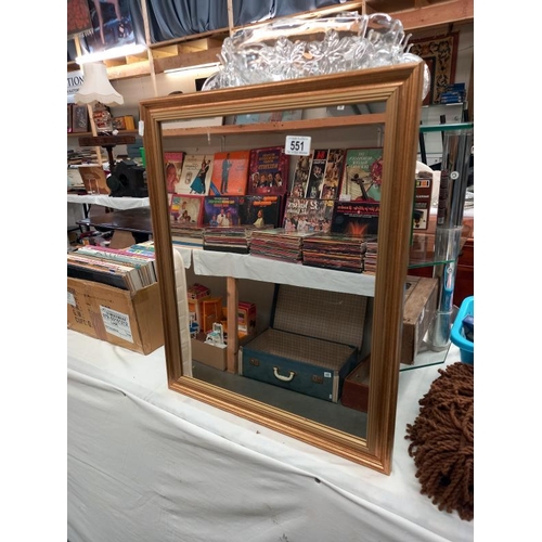 551 - A gilt framed bevel edged mirror.