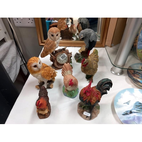 552 - A mixed lot of cockerel and owl figures, plus a grey parrot