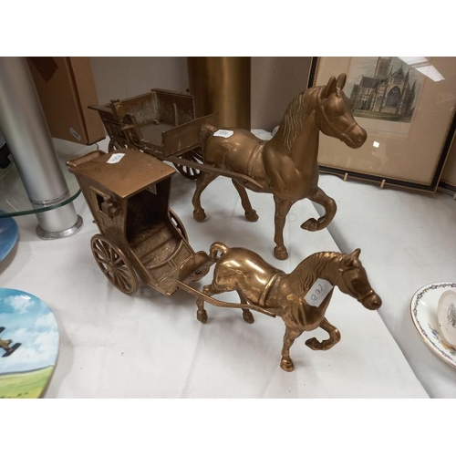 554 - A brass horse and cart, carriage and horse and piece of trench art